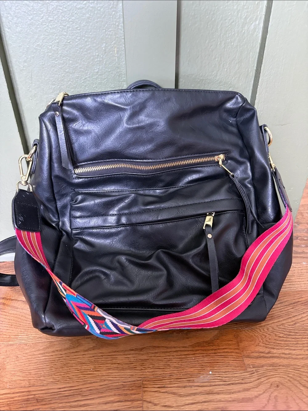 Black Leather Crossbody Tote with Colorful Striped Strap
